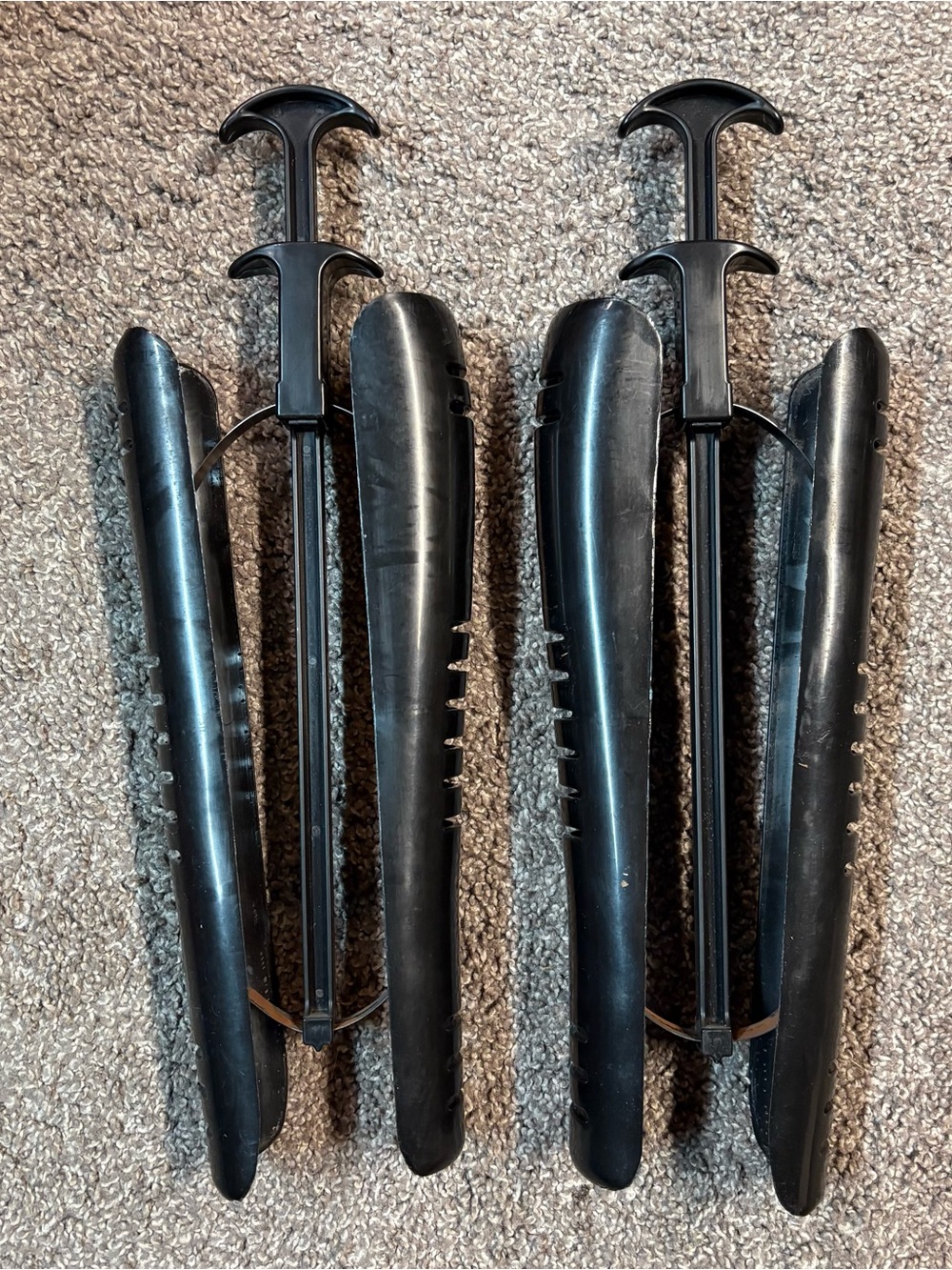 Plastic tall boot tree shapers.